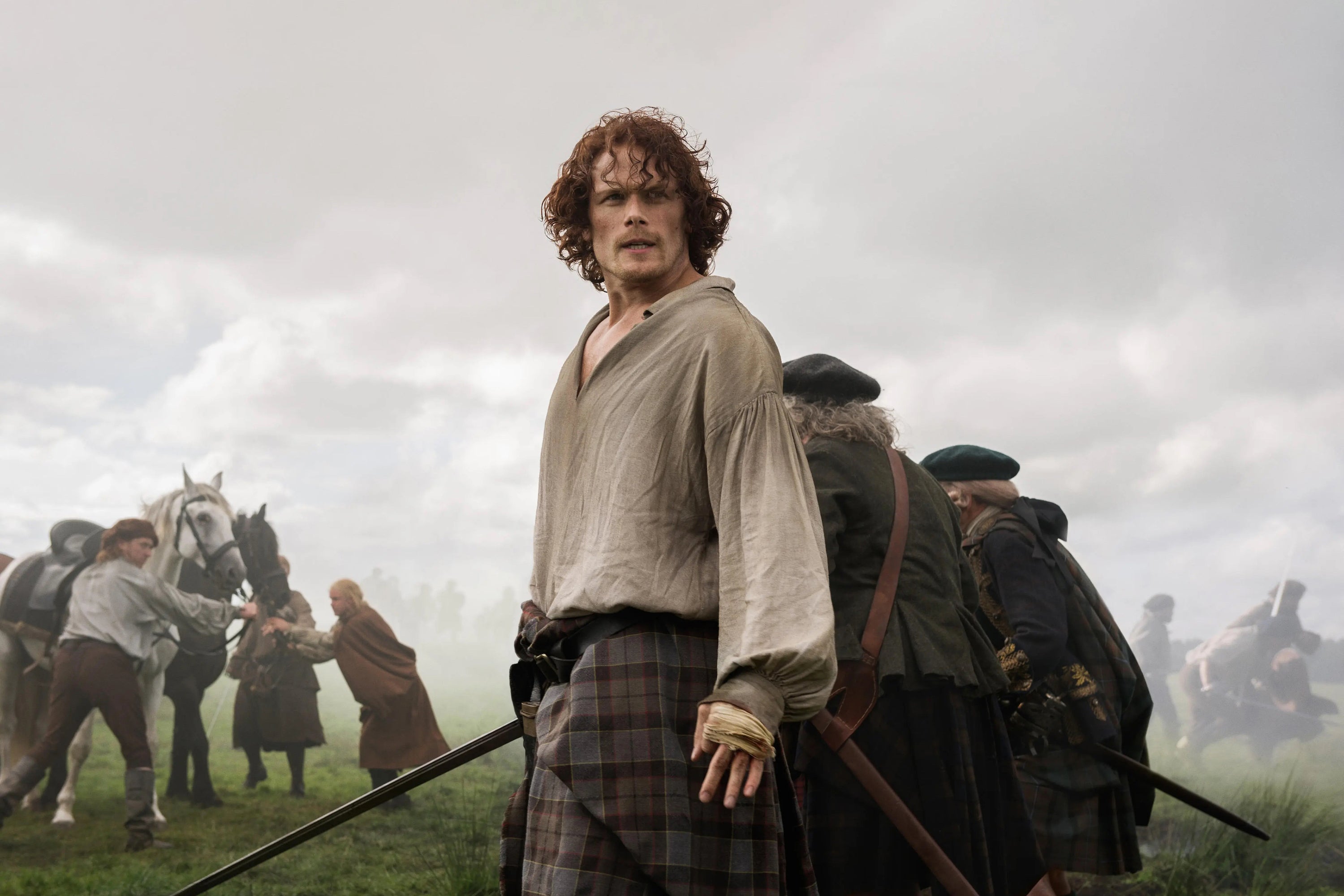 Waypoints Book Notes Review - Image of Sam Heughan on set of Outlander